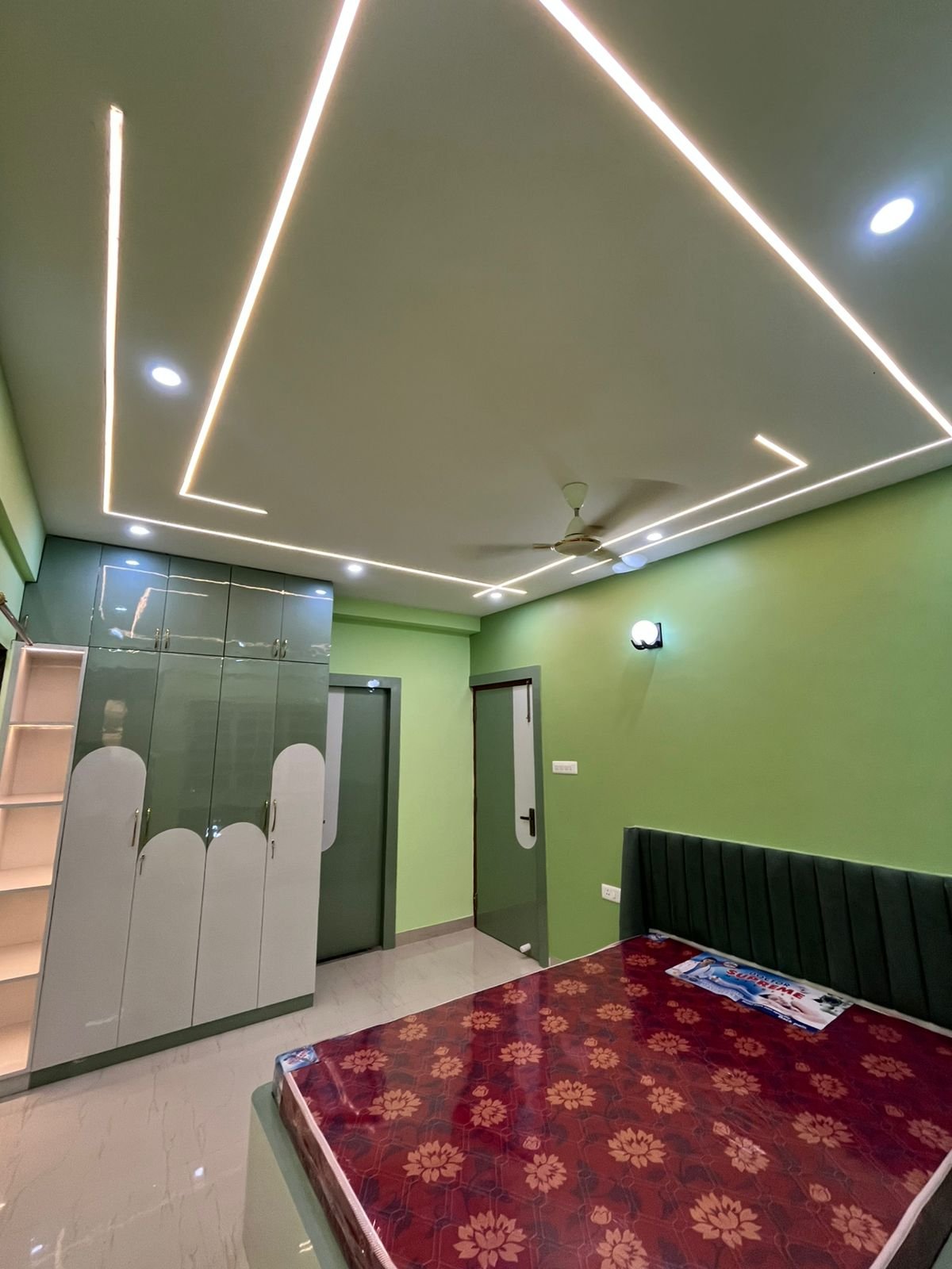 On-site bedroom interior with ceiling lighting